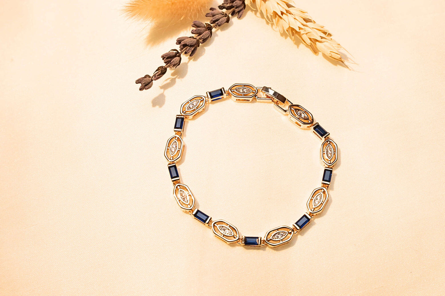 Luxury blue stone bracelet, gold-plated with precision-cut stones for a stunning accessory.