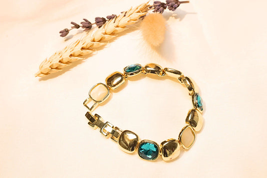 Luxury gold-plated bracelet featuring dazzling blue gemstones, adding a sophisticated touch to any outfit.