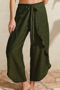 Antiocco green pants, chic outfit from women’s summer collection.
