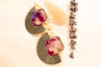 Gold-plated statement earrings with a bold red and pink resin stone, perfect for special occasions.