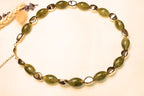 Boho-inspired necklace with artistic green stone accents.