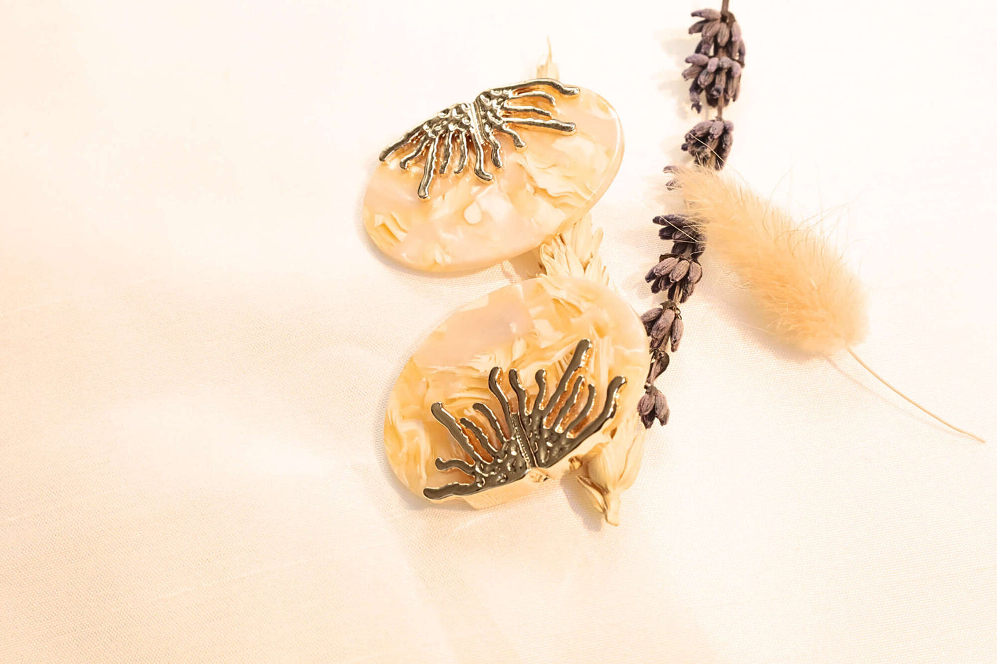 Elegant Coral Earrings with a pearlescent base and gold-tone coral details, perfect for ocean-inspired style lovers.