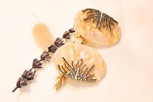 Luxurious Coral Earrings, featuring intricate gold coral detailing on a shimmering base for timeless elegance.