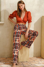 Sunset Ember Set featuring a textured crop top and flowy wide-leg pants in warm sunset tones for a bold, elegant look.