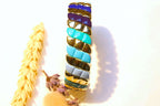 A unique bracelet featuring blue and turquoise enamel links, blending boho charm with modern elegance.