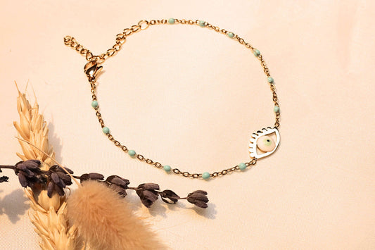 Evil eye charm bracelet with delicate bead details, perfect for daily wear.
