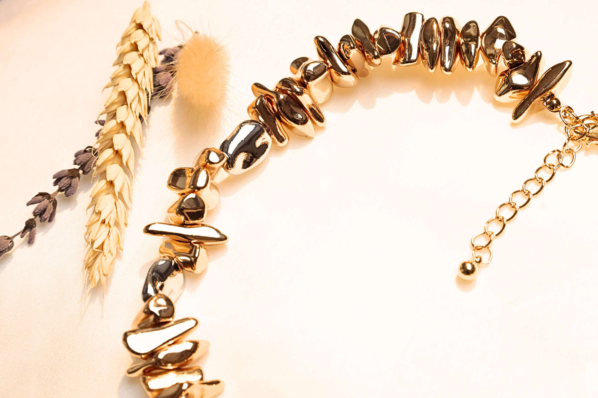 Gold-plated brass necklace with natural stone details.