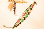 Gold-Plated Gemstone Statement Bracelet – A mix of vibrant gemstones and gold-plated details for an elegant touch.