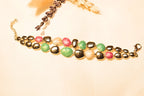 Gold-Plated Gemstone Statement Bracelet – Stunning gold-plated textures with vibrant gemstones for statement styling.