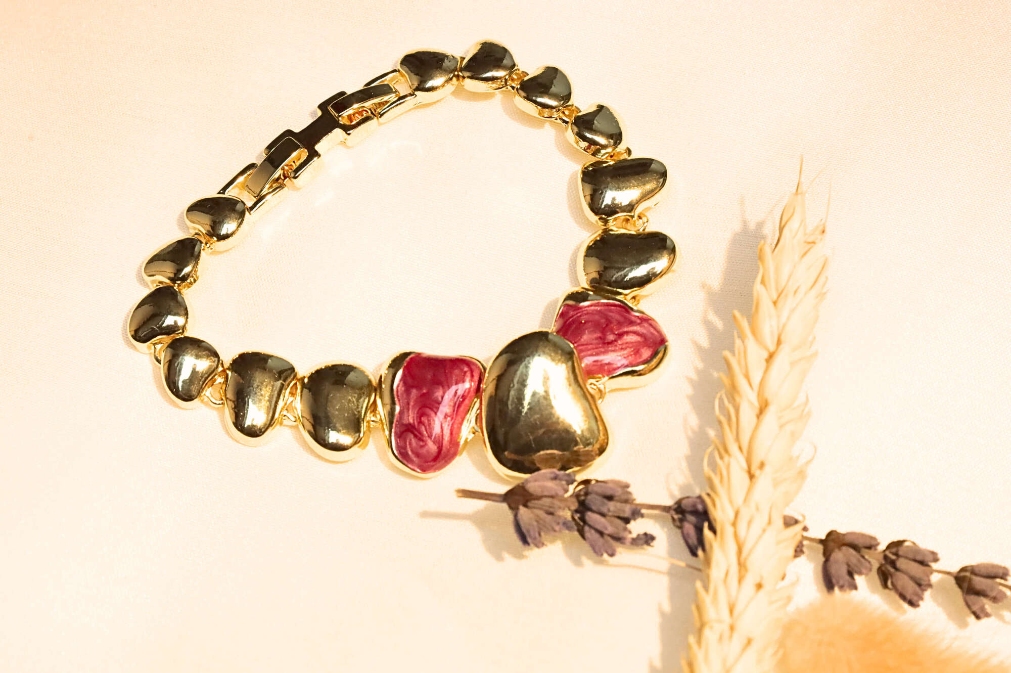 Charming red heart bracelet with a luxurious gold finish, designed for those who adore timeless romantic jewelry.