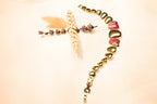 Gold-plated bracelet with heart motifs and red gemstones, a stunning piece to complement any elegant outfit.