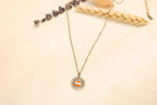 Shiny sun necklace with an adjustable chain for a comfortable fit.