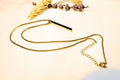 Elegant gold-toned bar pendant necklace with a sleek, modern chain. Perfect for layering or solo styling.