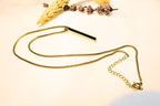 Elegant gold-toned bar pendant necklace with a sleek, modern chain. Perfect for layering or solo styling.
