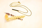 Timeless gold chain necklace with a sleek vertical bar charm. Ideal for everyday wear or special occasions.