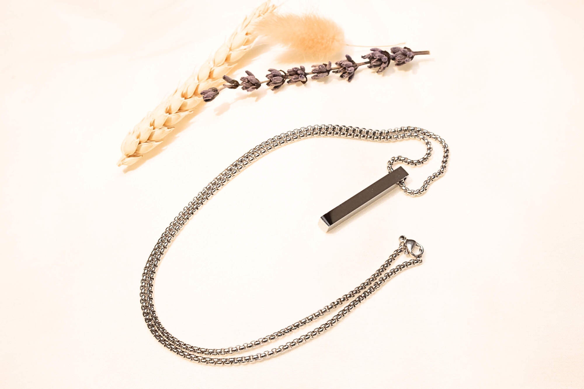 Classic silver box chain necklace with a minimalist bar pendant. Great for layering or solo wear.
