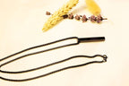 Bold black bar pendant necklace with a contemporary chain design. A statement piece for any wardrobe.