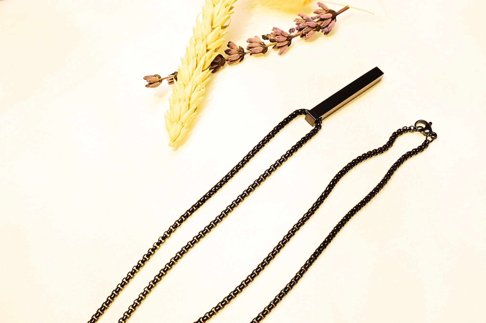 Modern black stainless steel necklace with a rectangular pendant. Sleek, edgy, and stylish.