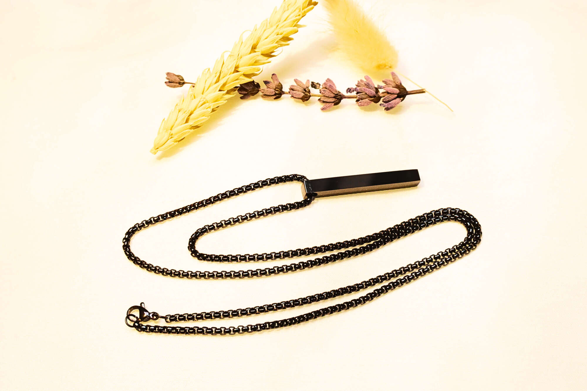Matte black bar pendant necklace with a minimalist chain. Perfect for streetwear and casual outfits.