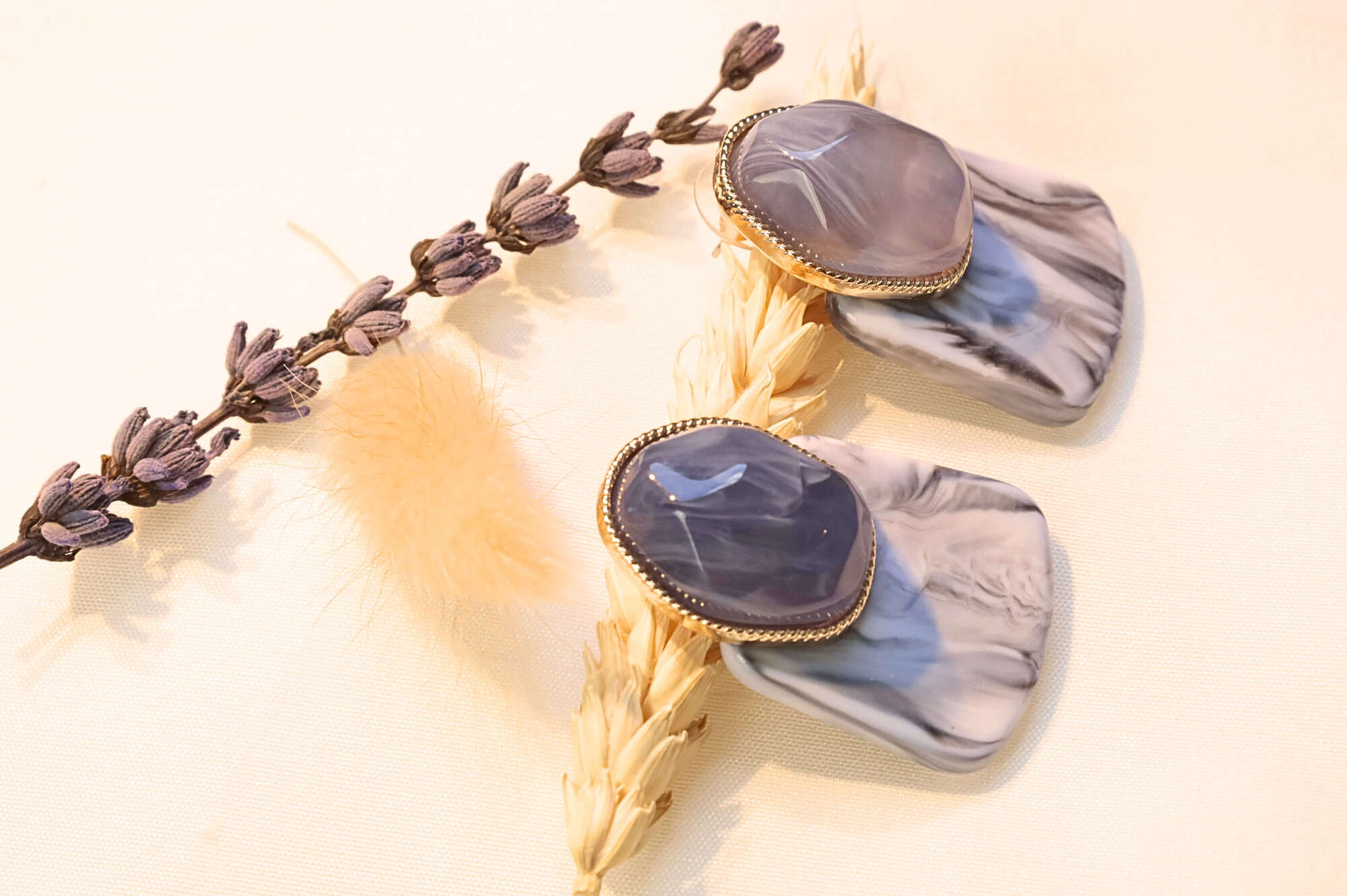 Elegant marble stone earrings with gold-plated setting in a purple and gray mix.