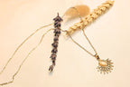 Shiny sun necklace – A striking design with delicate gold accents and a pearl.