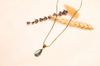 Sparkling turquoise stone and delicate chain necklace design.