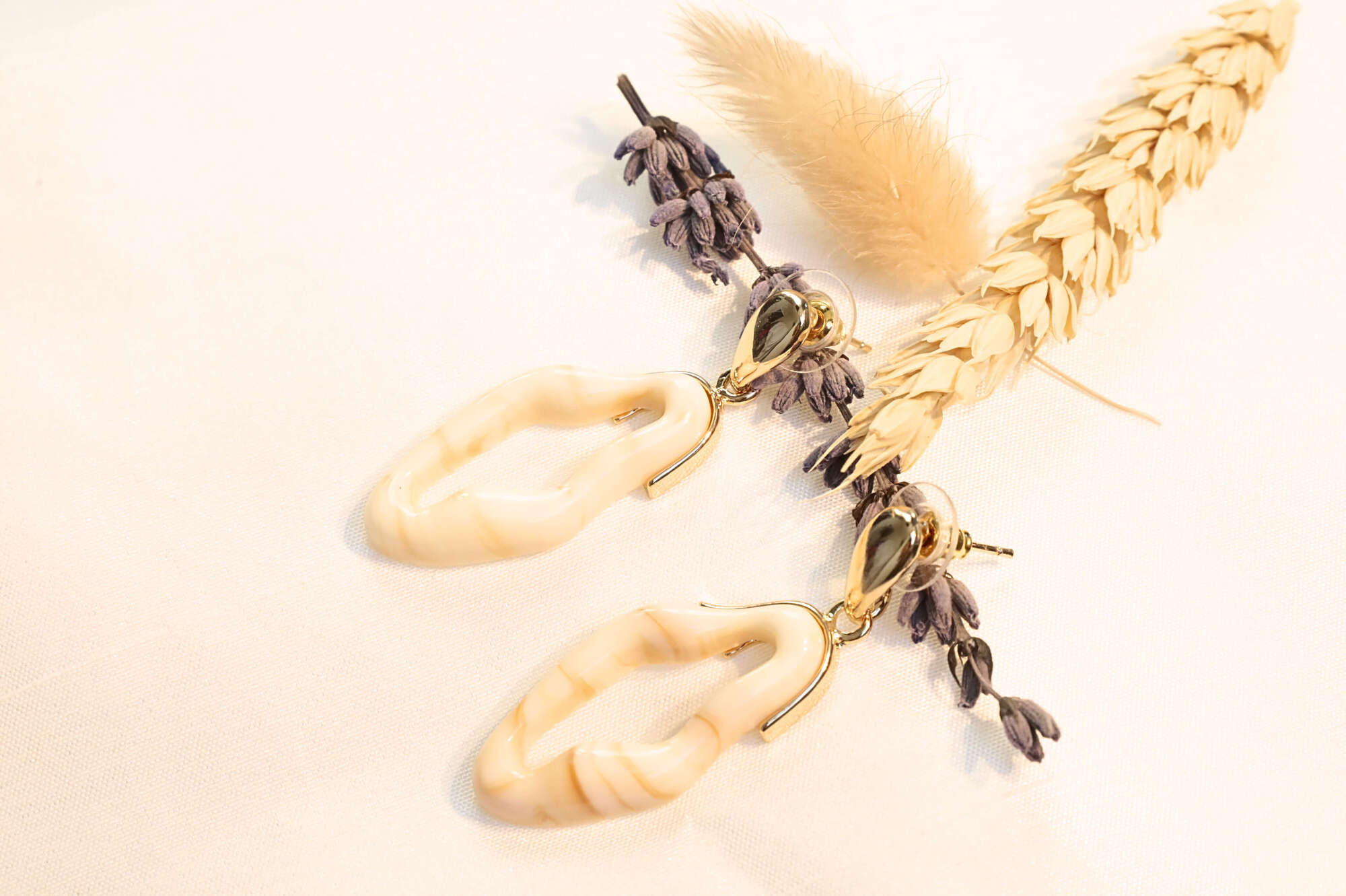 WaveFlow earrings bring fluid, modern elegance with a unique gold-plated wave design – perfect for effortless sophistication.