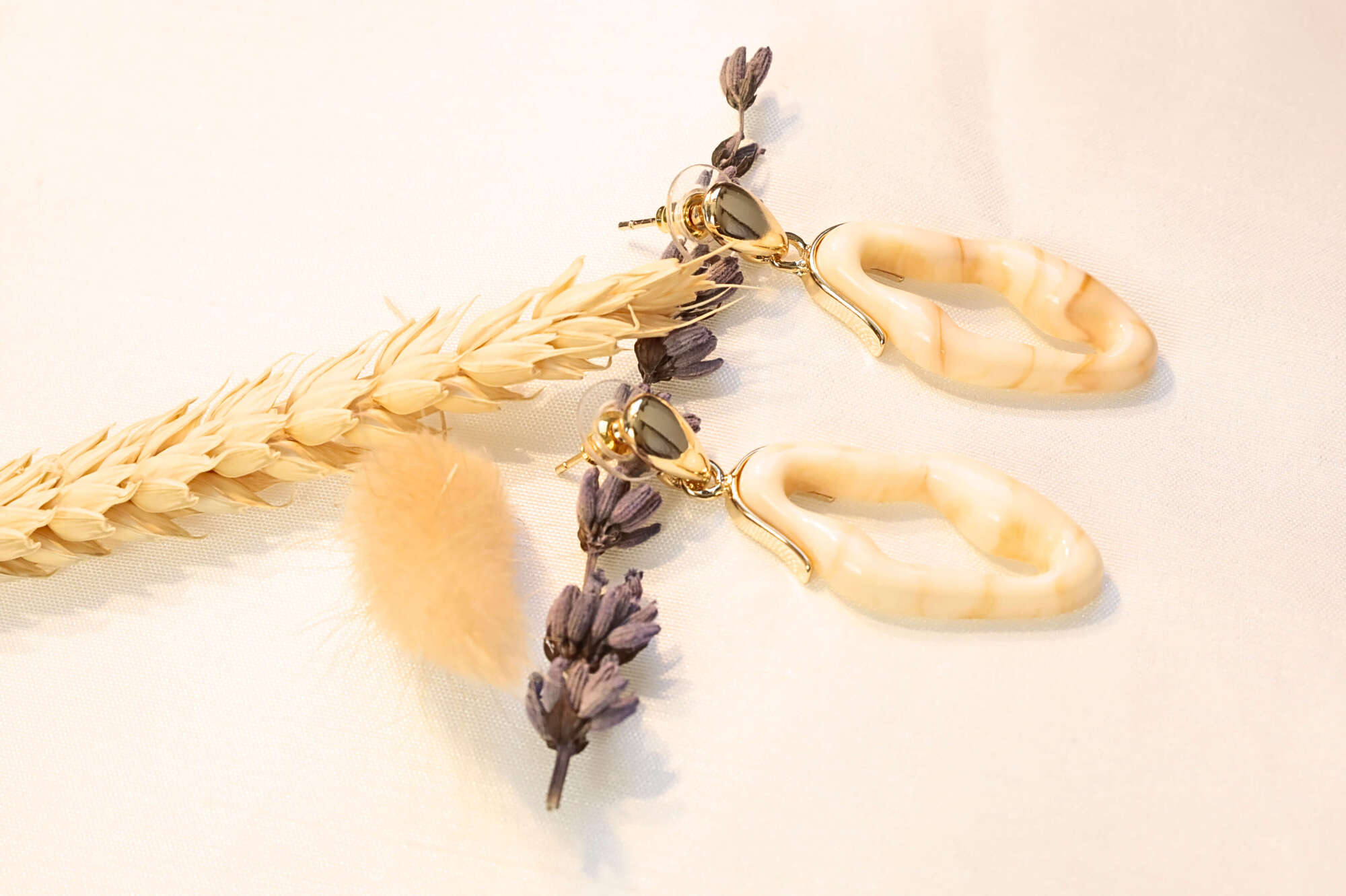 With an organic wave-inspired shape, these earrings add a touch of luxury to any look.