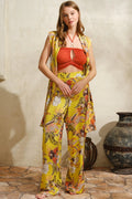 Wildflower Harmony 3-Piece Set featuring a floral vest, wide-leg pants, and an orange ruched top.