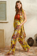Bohemian-inspired yellow floral set with a flowy vest and breezy wide-leg pants.