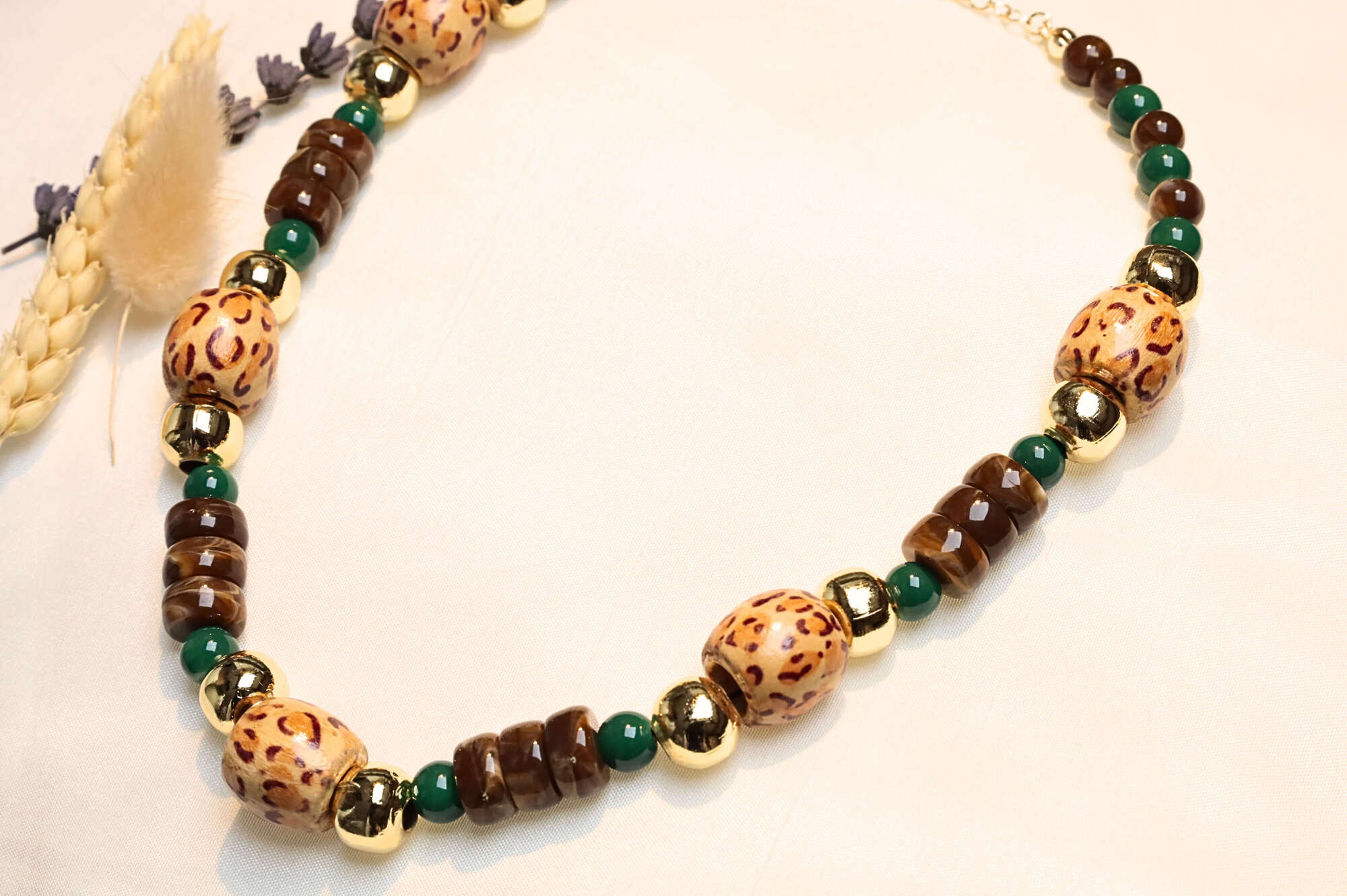 Close-up of handcrafted ethnic necklace with earthy beads.
